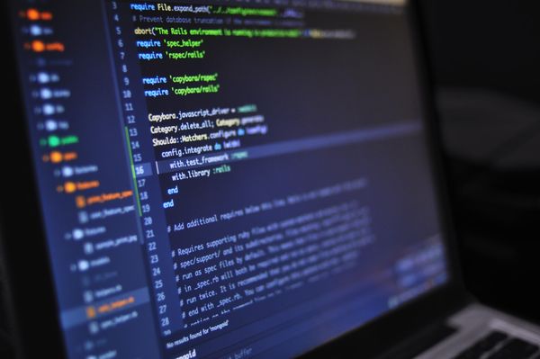 Programming code on a dark screen, representing structured automation logic